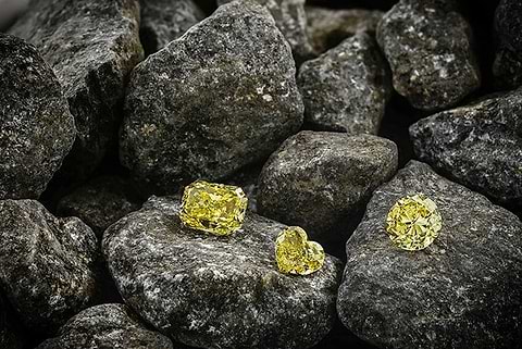 Yellow diamonds within the field of rocks
