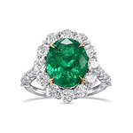 Oval Muzo Emerald and Diamond Halo Ring