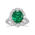 Oval Muzo Emerald and Diamond Halo Ring