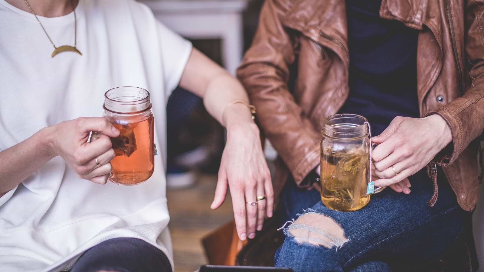 How to get rid of bloating: Two women drink tea