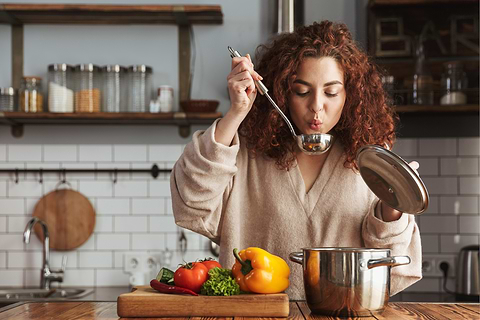 Girl Making and Trying Soup