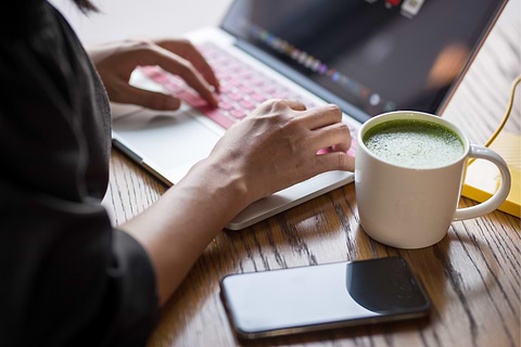Person working drinking matcha