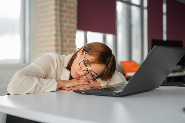 Woman wondering when to see a sleep specialist to solve her sleep issues