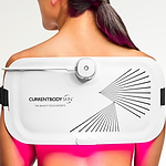 CurrentBody LED Light Therapy Panel on woman's back for pain relief and skin treatment
