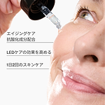 Woman applying the CurrentBody Skin Green Tea Serum with key features listed