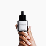 Person holding the CurrentBody Skin Green Tea Serum
