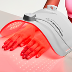 Hand treatment with CurrentBody red LED light therapy panel for anti-aging