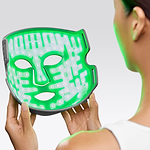 Woman holding the Multi-Light Therapy Mask
