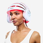 Woman using CurrentBody LED Hair Growth Helmet on her head