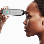 woman using anti-aging device on frown lines