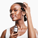 woman applying the CurrentBody Skin Green Tea Serum