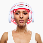 Woman using CurrentBody LED Hair Growth Helmet on her head