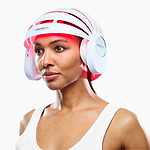 Woman using CurrentBody LED Hair Growth Helmet on her head