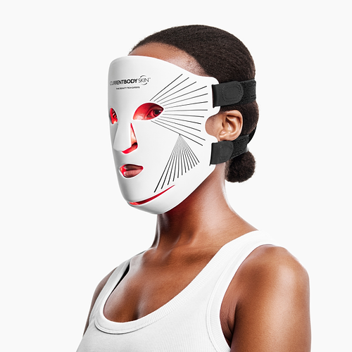 Woman using CurrentBody Red Light LED Face Mask Series 2 on her face