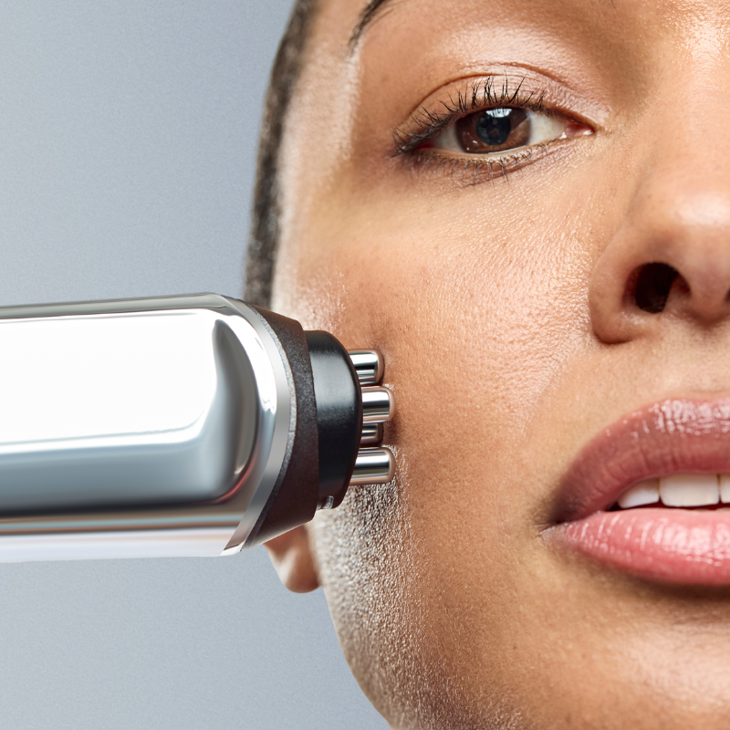 Woman using the CurrentBody RF device