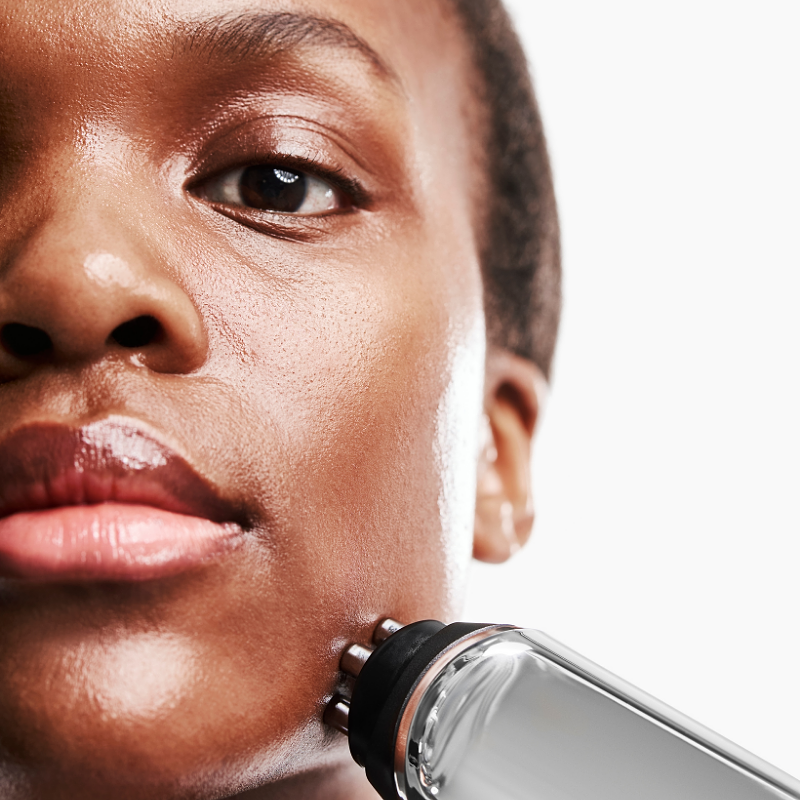 Close-up of CurrentBody RF skin tightening device being applied to jawline