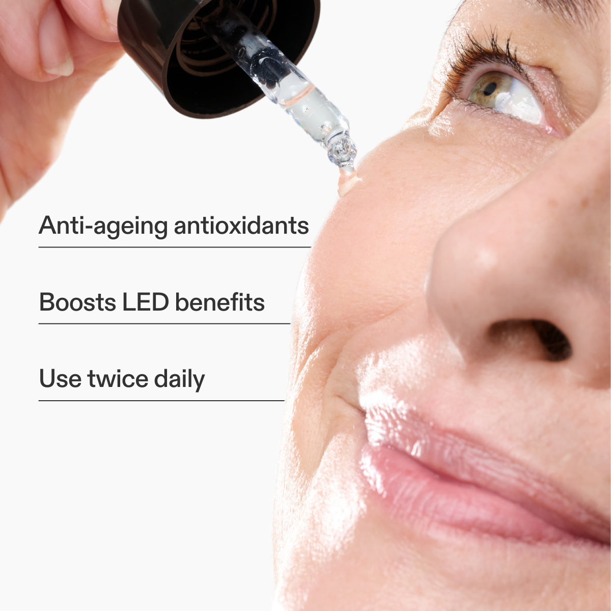 Woman applying the CurrentBody Skin Green Tea Serum with key features listed