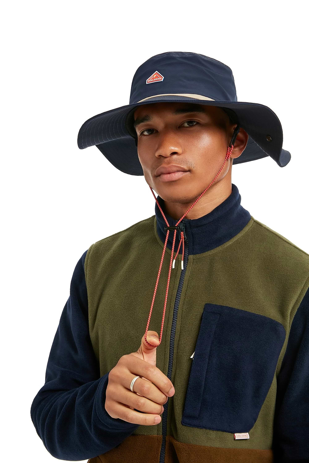 A man is wearing a boonie hat