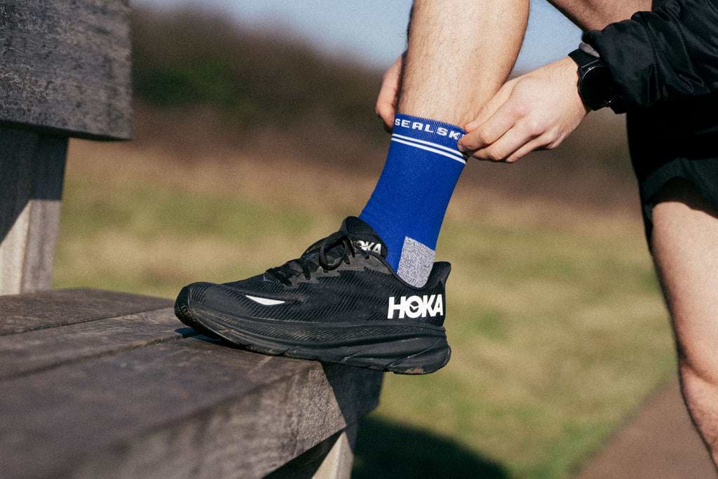 A man fitting his socks