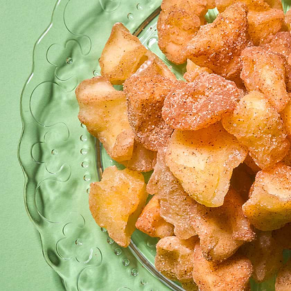 Apple pieces coated with cinnamon and sugar