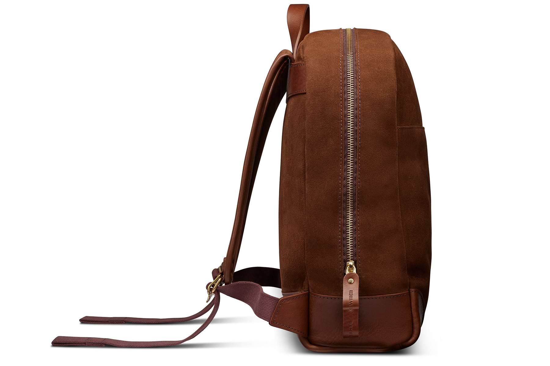 side view of sleek brown suede backpack