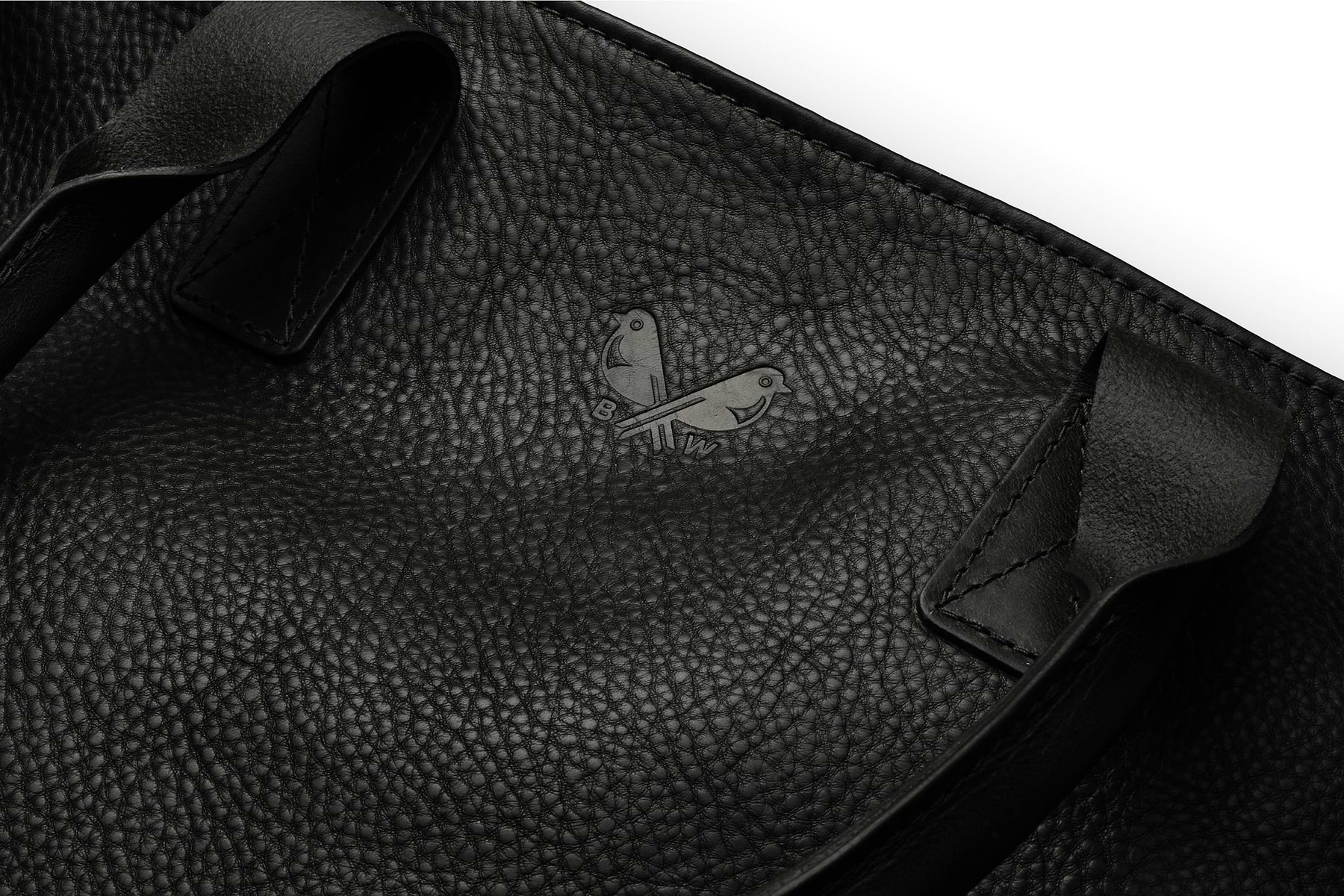 the Bennett Winch logo pressed into the black leather tote