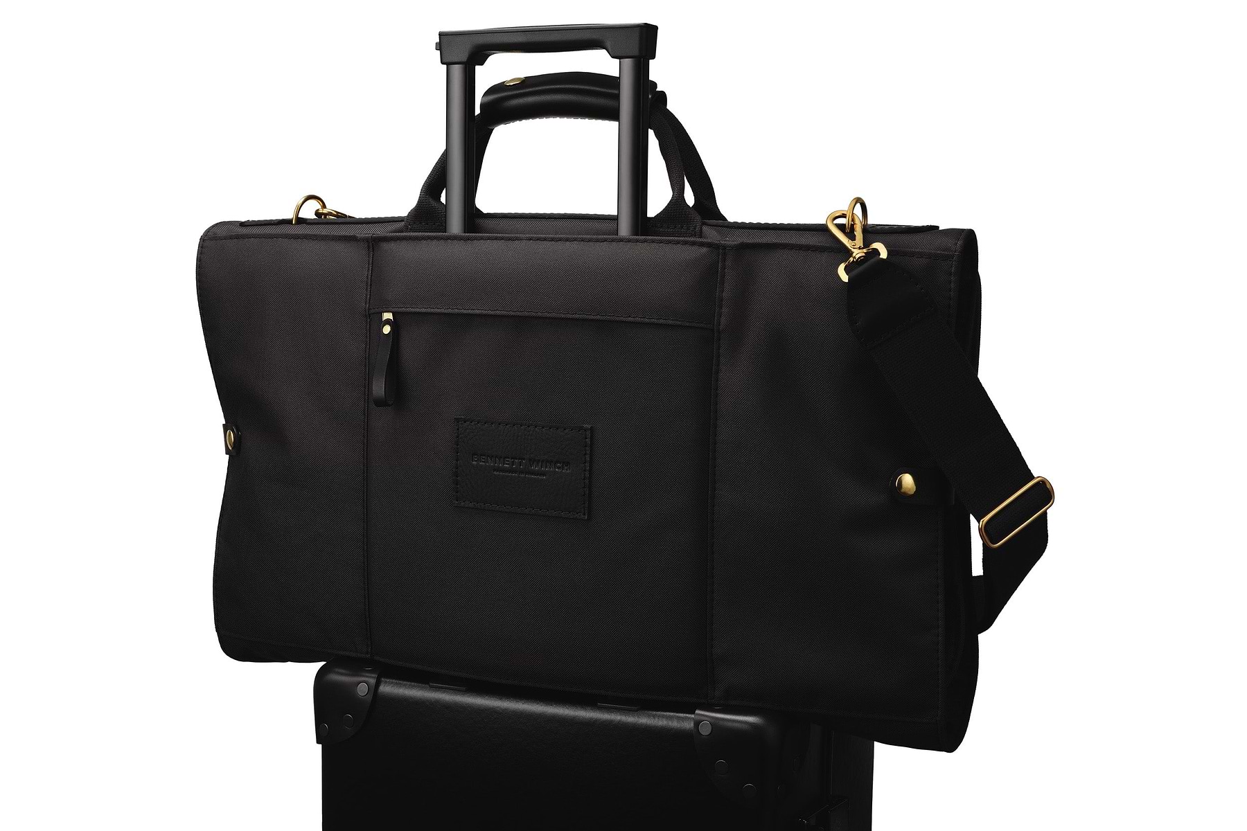 luxury trifold on top of a luggage