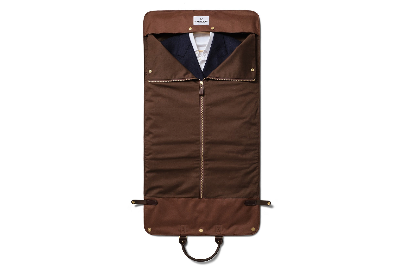 the trifold laid out zipped up with clothes inside