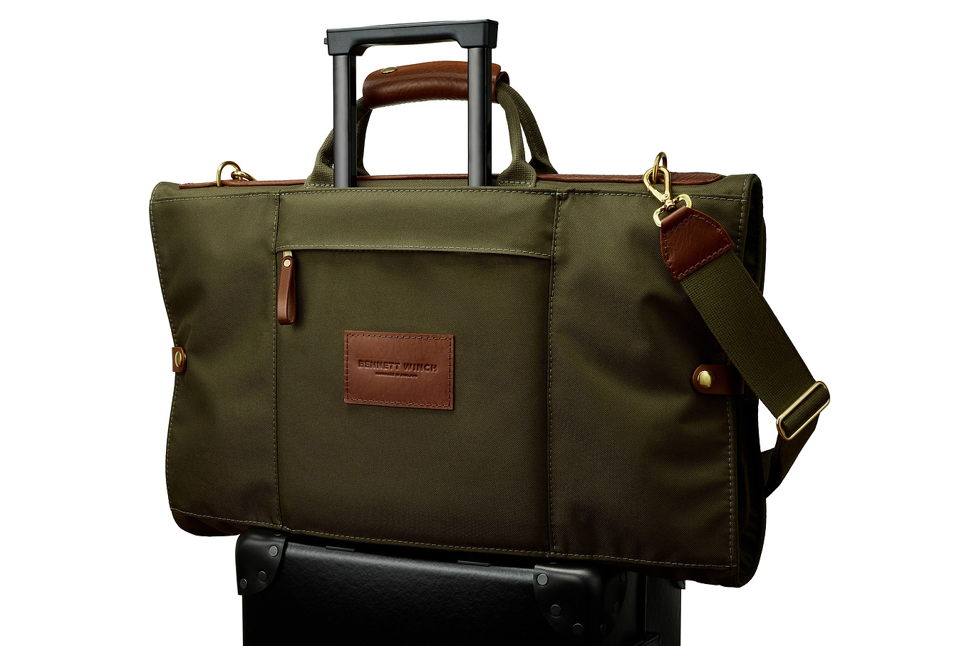 high end trifold on top of luggage