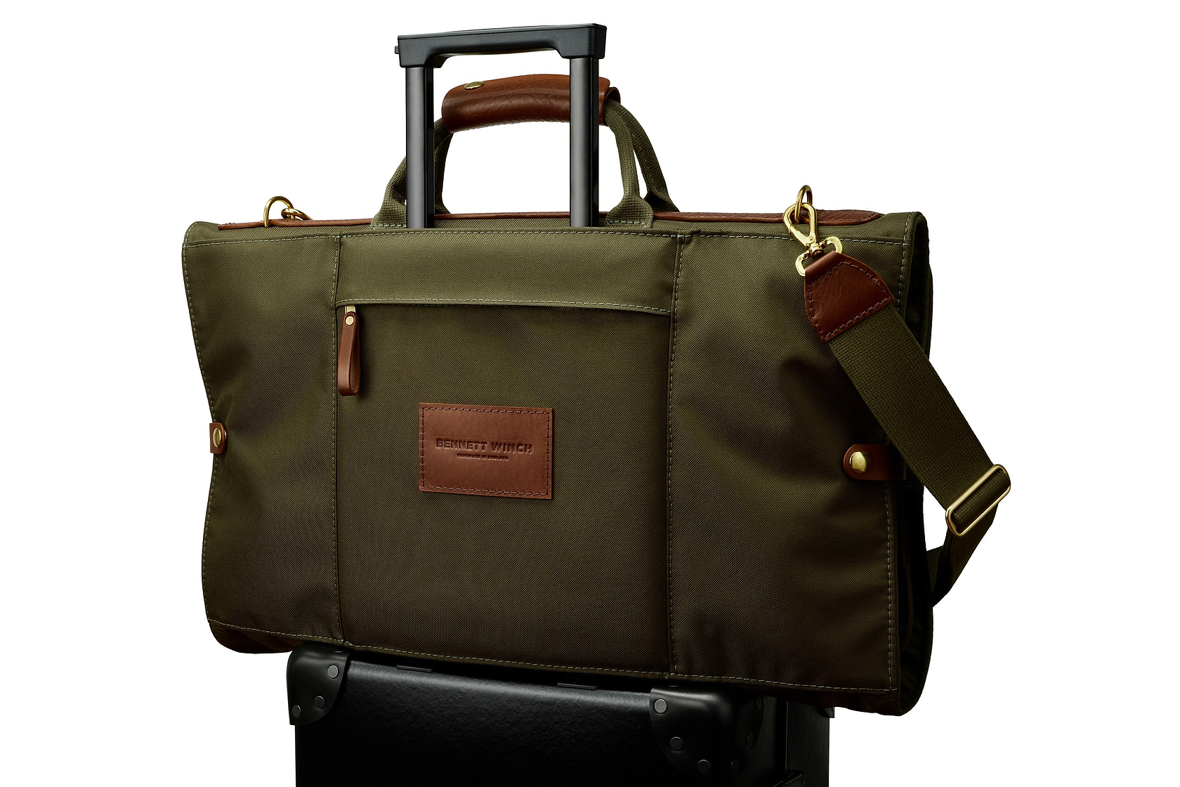 high end trifold on top of luggage
