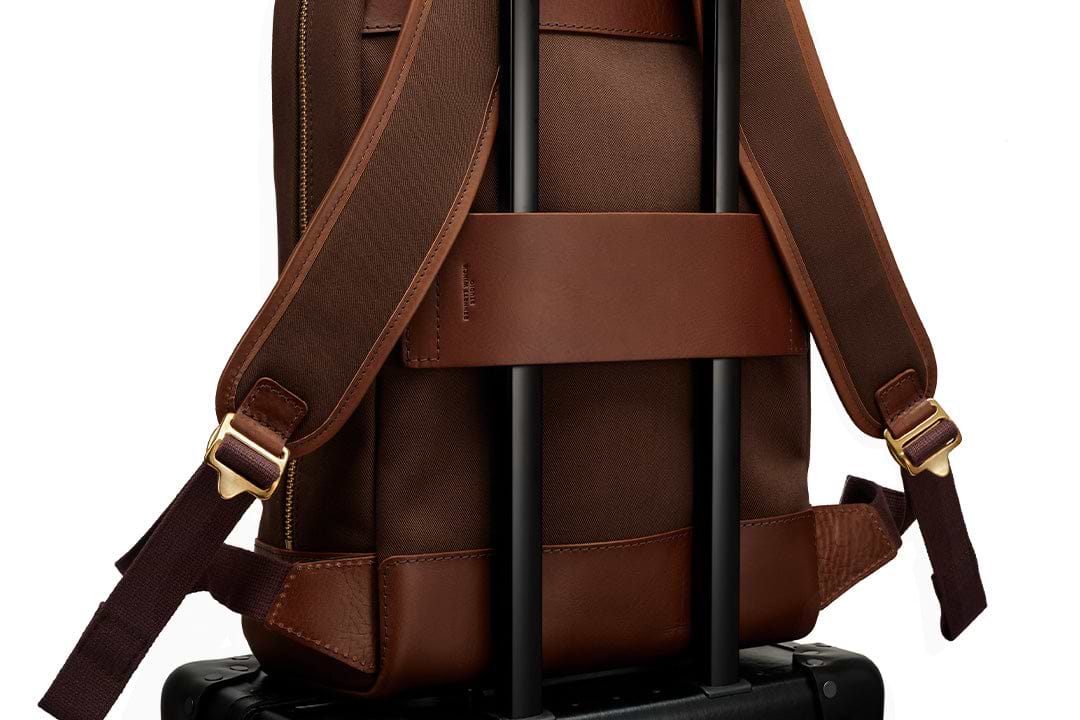 wide quality leather luggage strap on brown backpack 