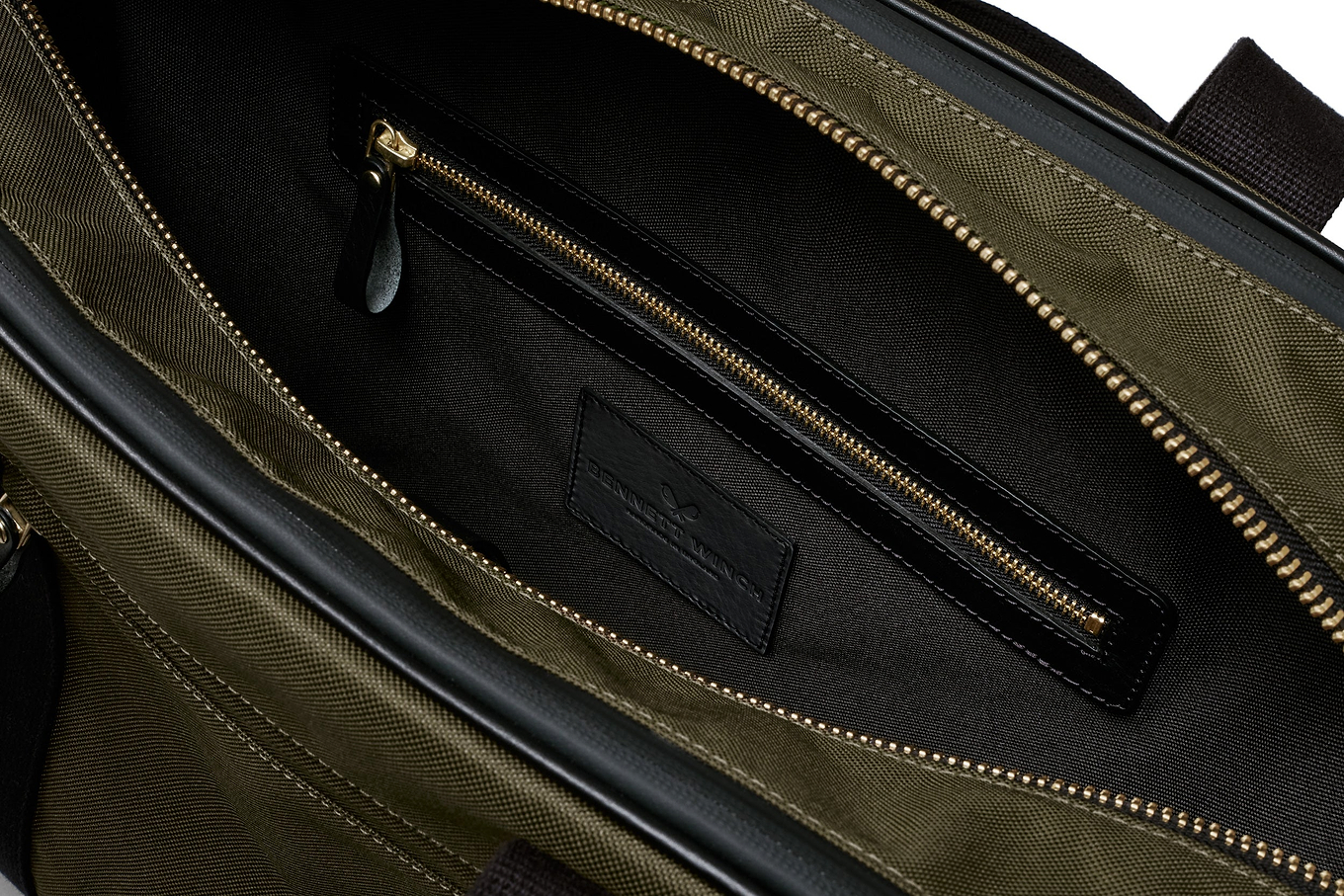 open view of the designer tennis bag in olive, showing the inside pocket