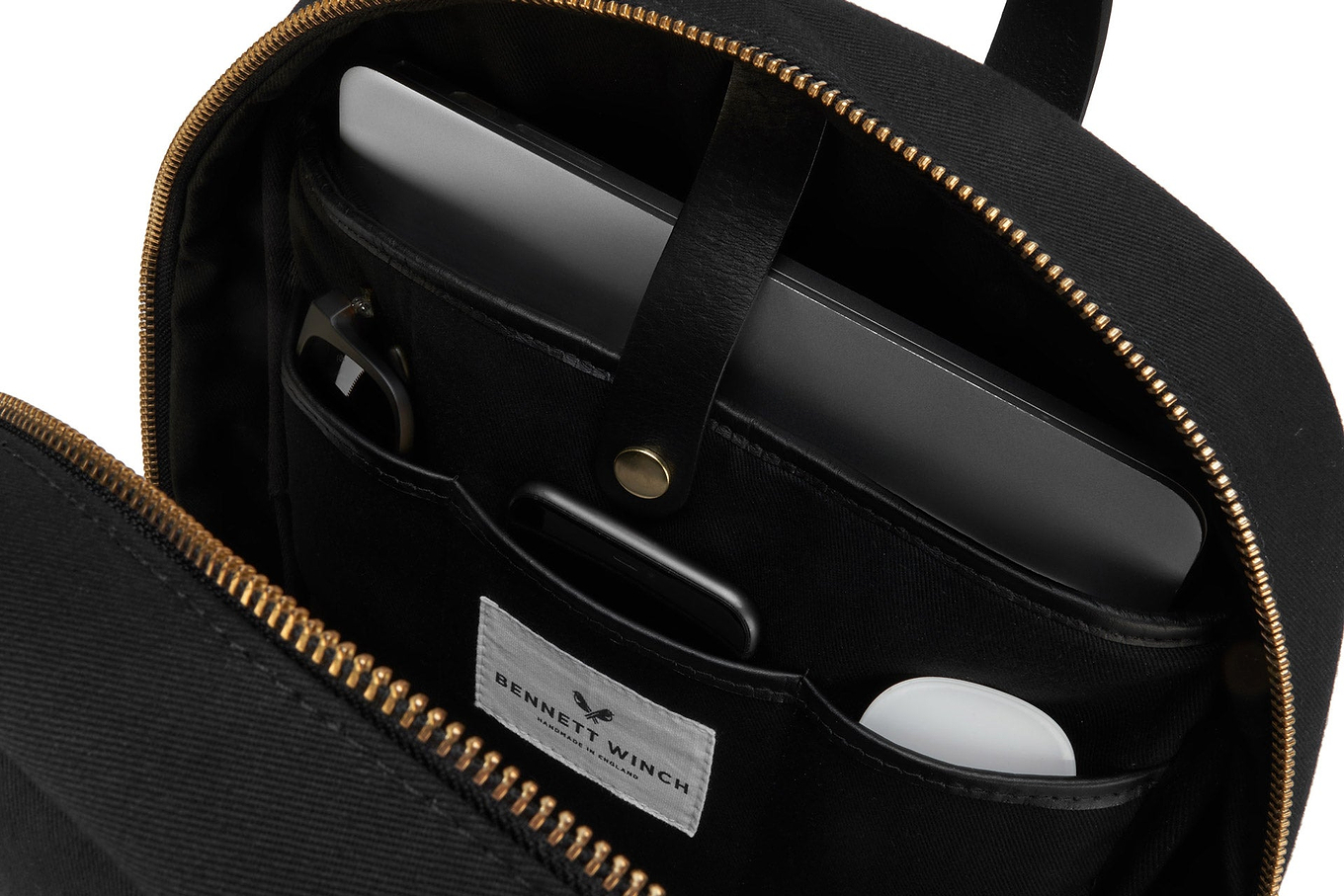 organizers compartments in sleek black canvas backpack