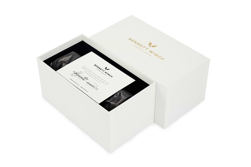 The white handmade gift box the brown single watch roll arrives in