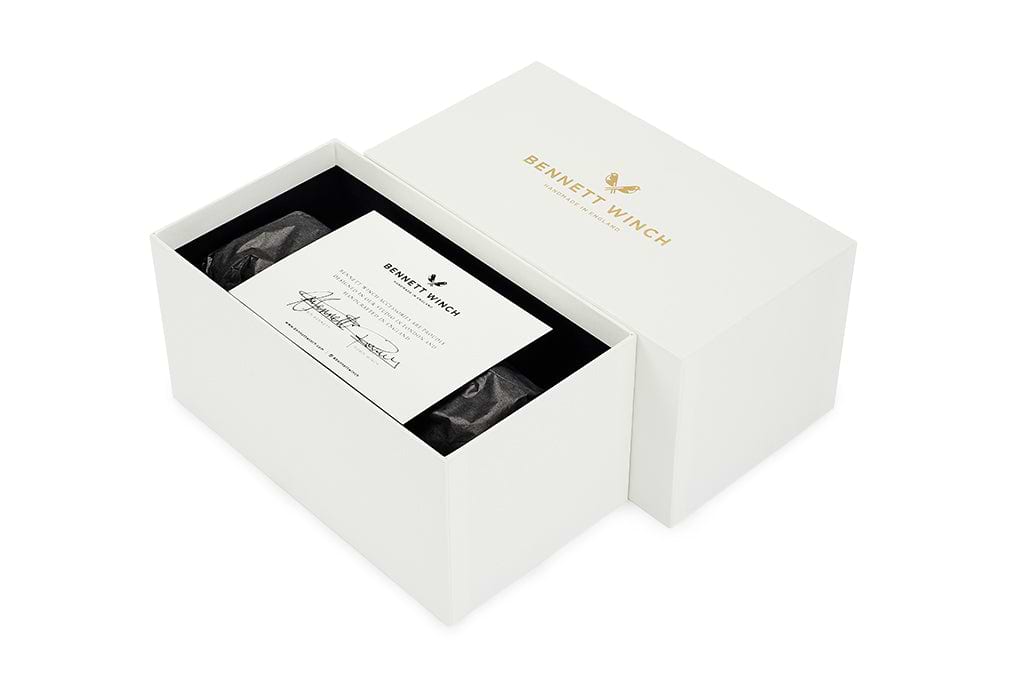 The white handmade gift box the triple watch roll arrives in