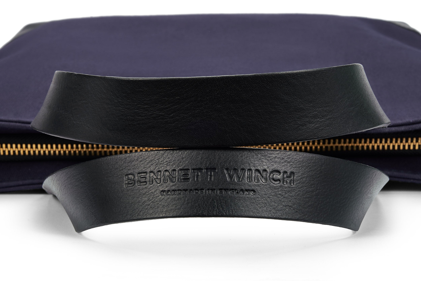 Bennett Winch name pressed into quality leather handle of navy canvas tote