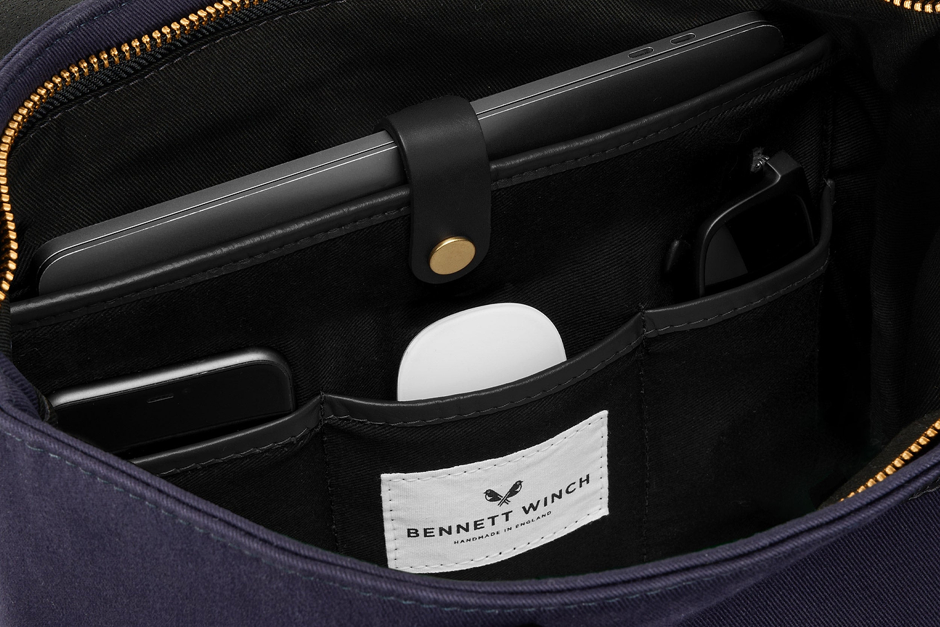 organizer space for laptop and essentials in navy canvas tote bag 