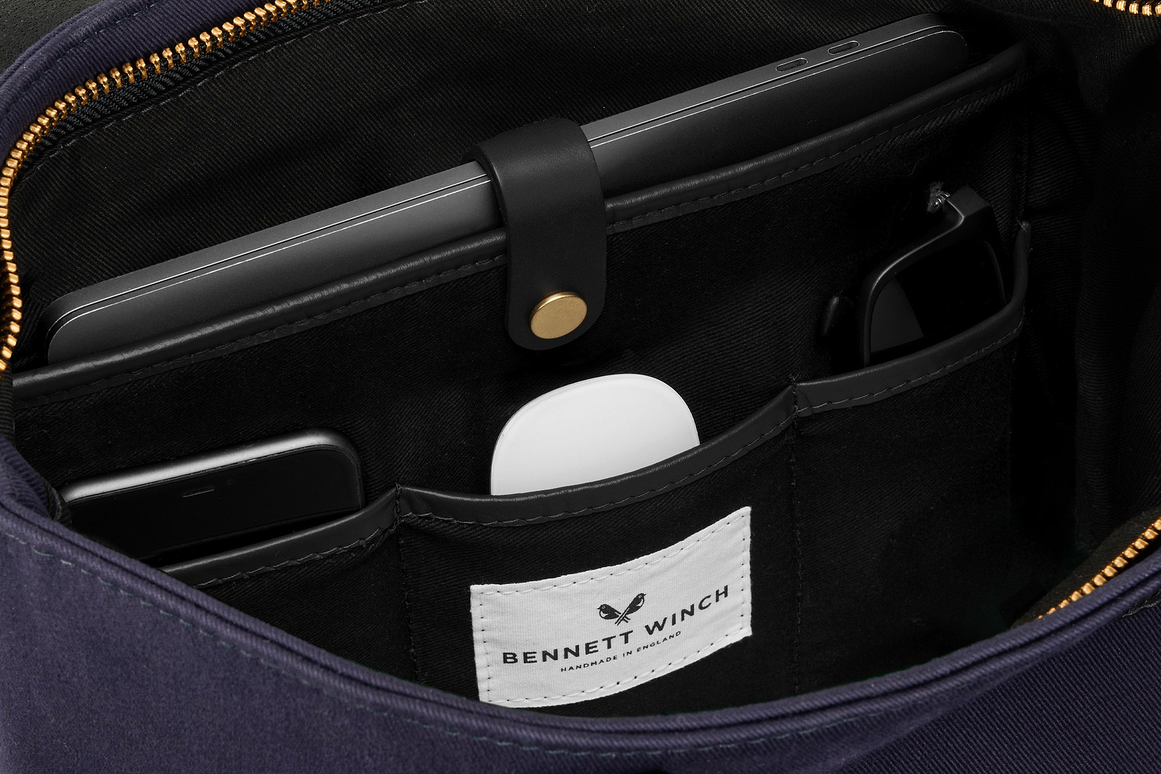 organizer space for laptop and essentials in navy canvas tote bag 