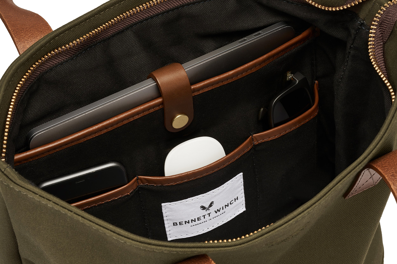 organizing space in green canvas tote bag 