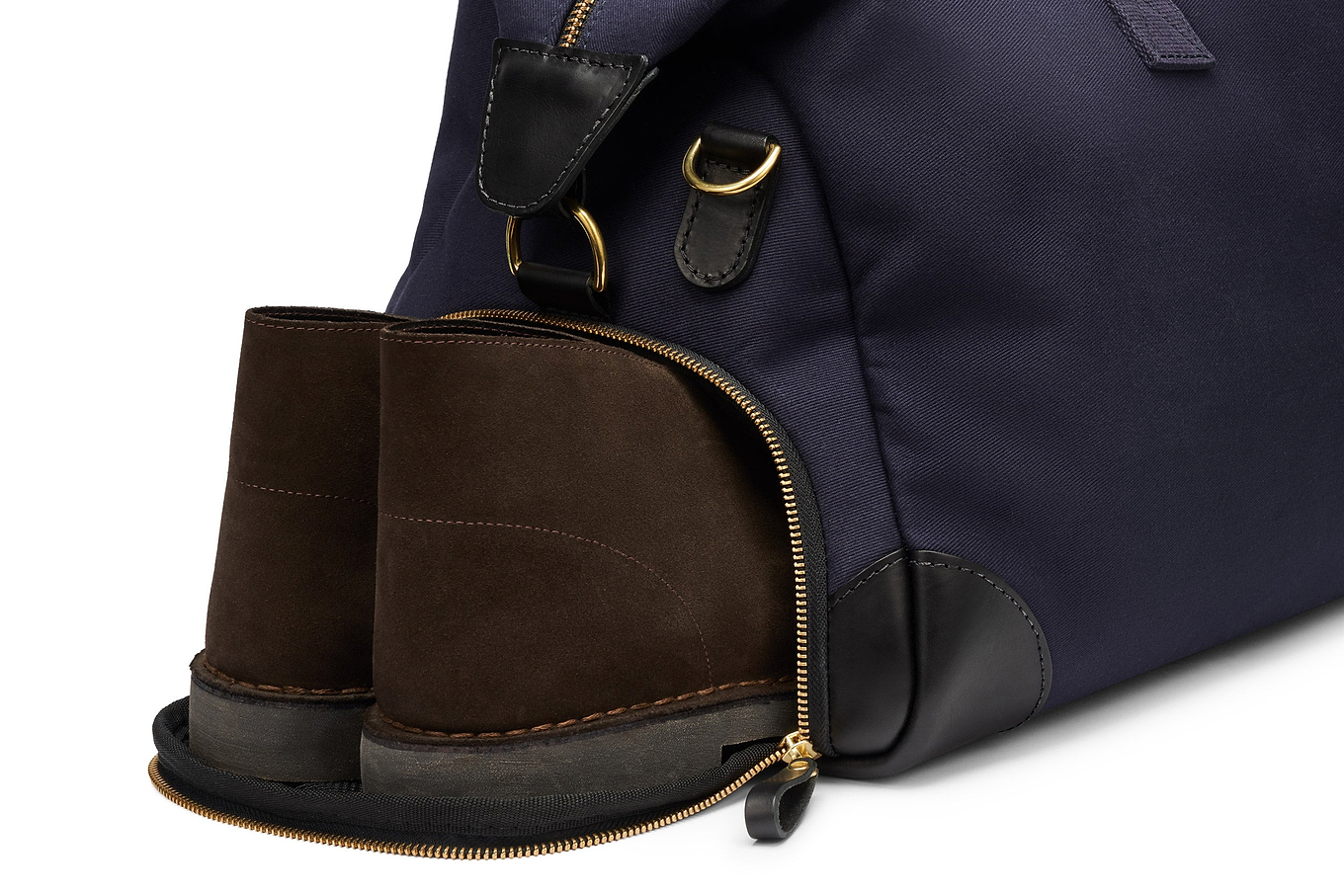 close up of separate shoe compartment in the weekender bag for men