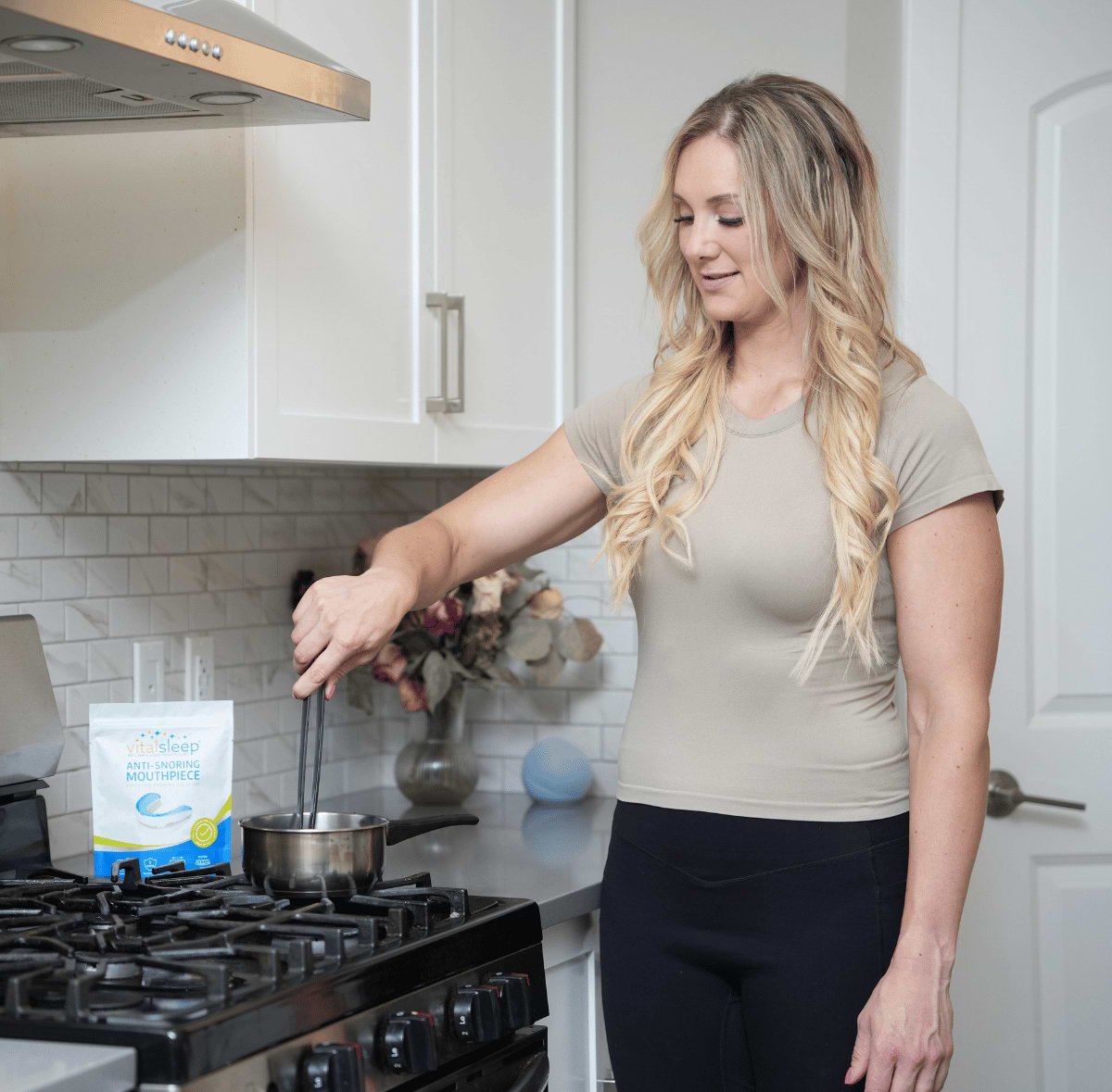 woman fitting vitalsleep snoring device