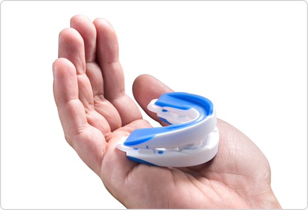 mouthpiece being held in hand