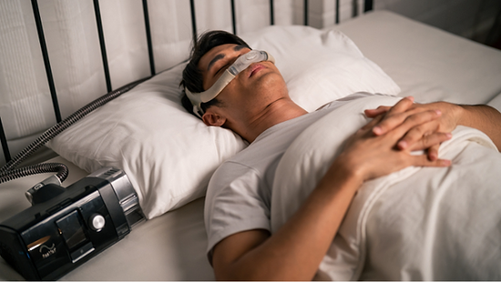 man sleeping using cpap machine