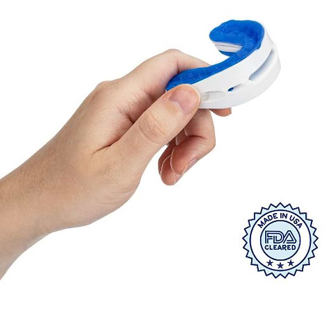 hand holding snoring mouthguard
