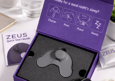 Zeus snoring device worn under chin to reduce nighttime snoring