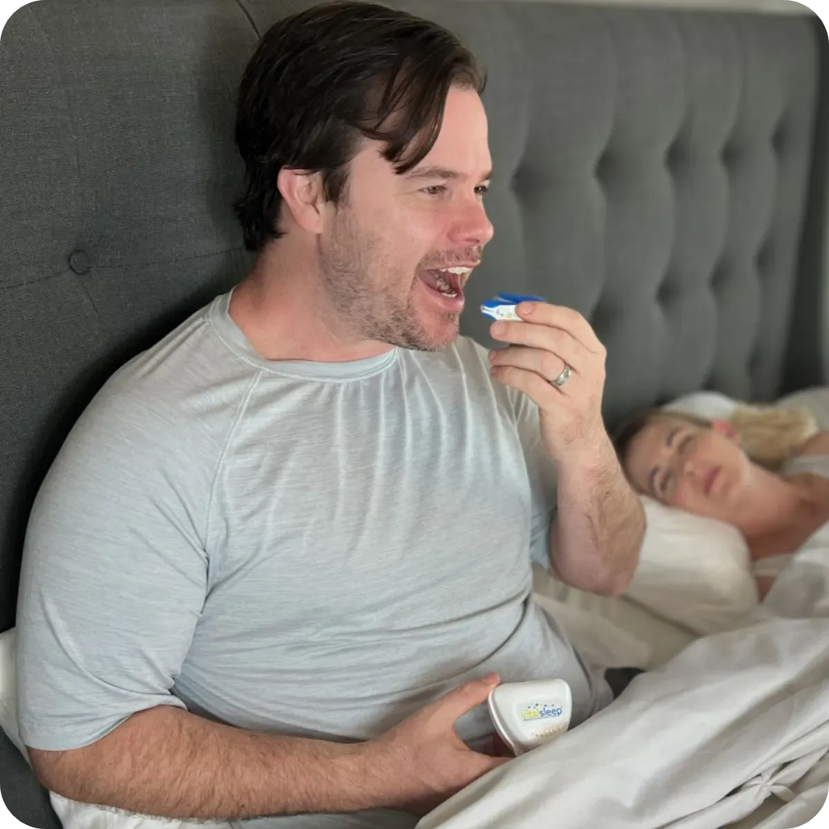 man putting mouthpiece in mouth