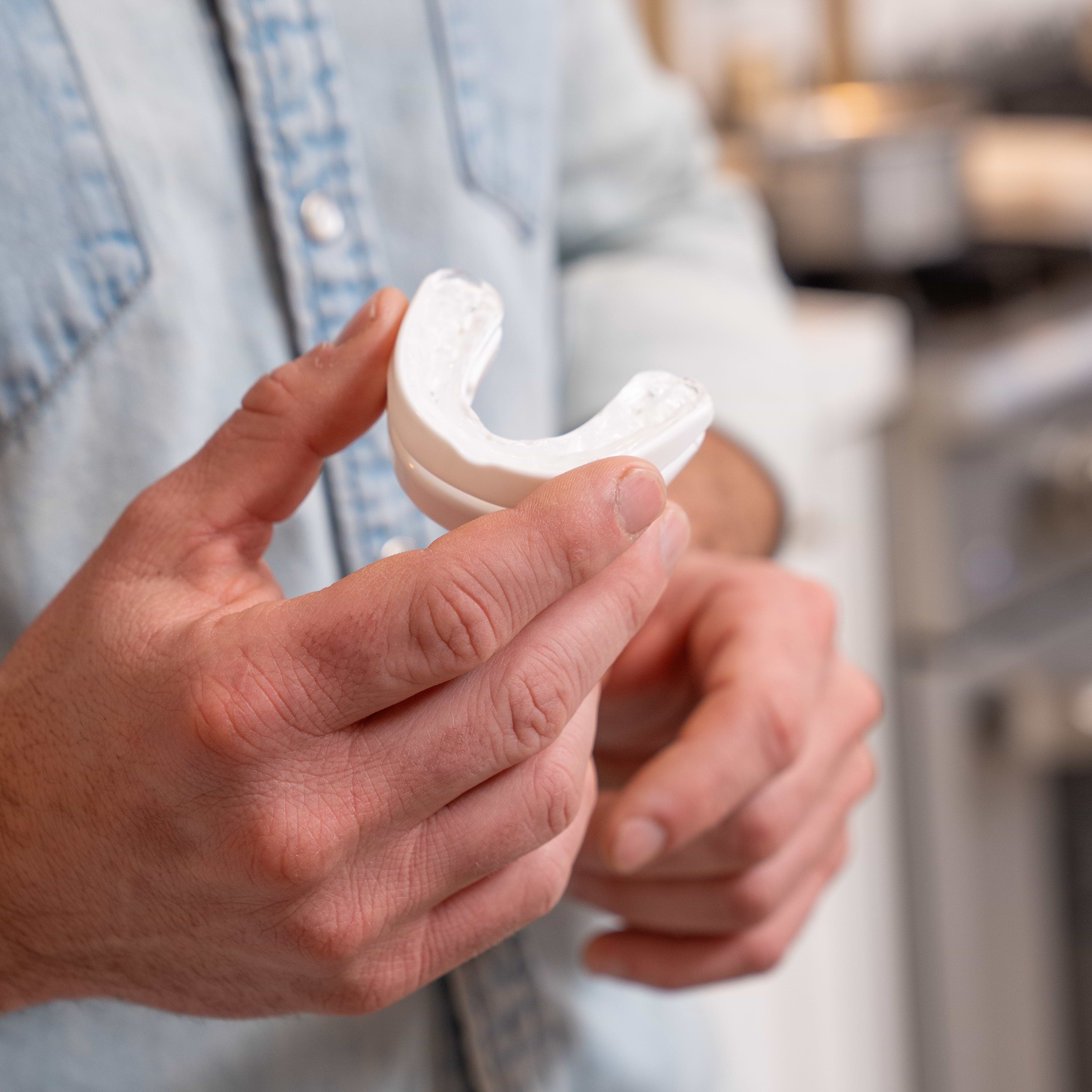 holding snoring device for better sleep
