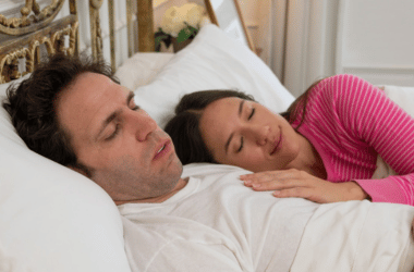 Couple peacefully sleeping side by side in a cozy bedroom, showcasing intimacy and serenity