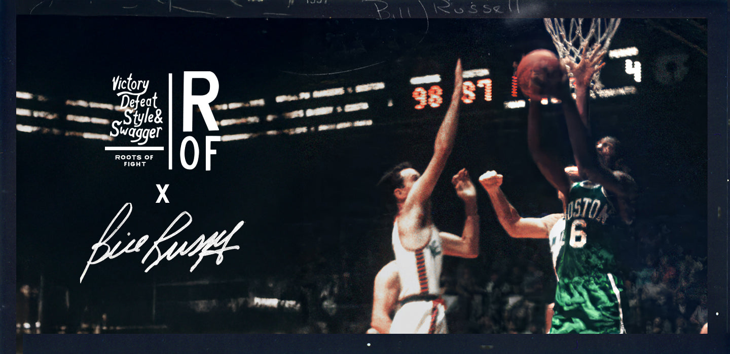 Historic basketball game with players near the hoop and signature overlay.