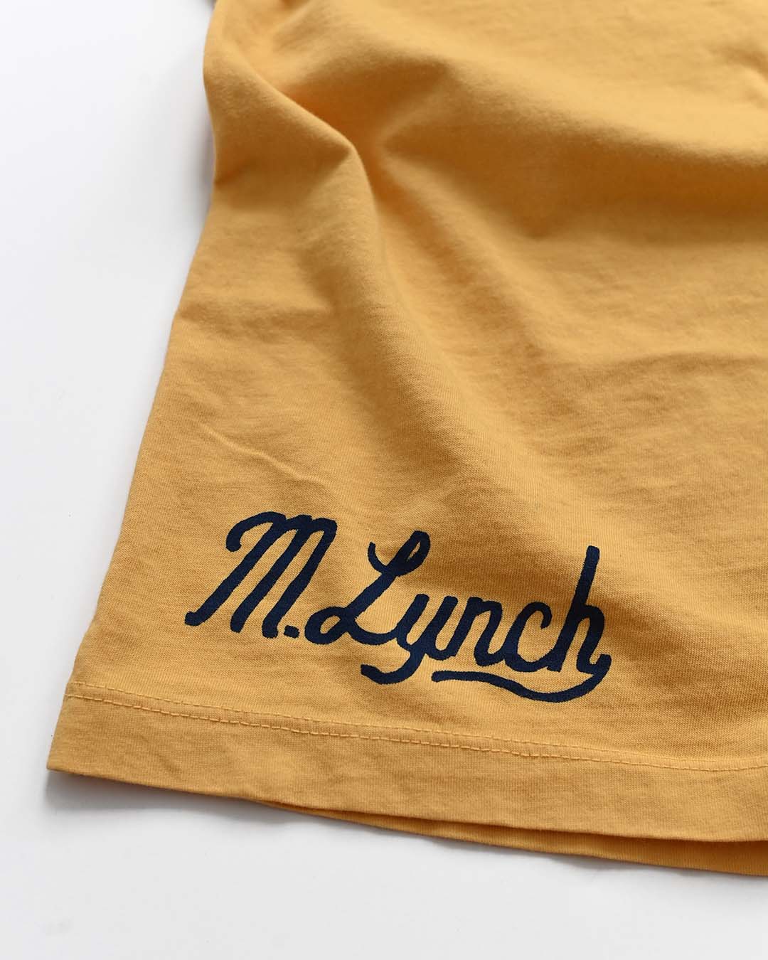 CAL - Marshawn Lynch #10 Gold Tee - Roots of Fight